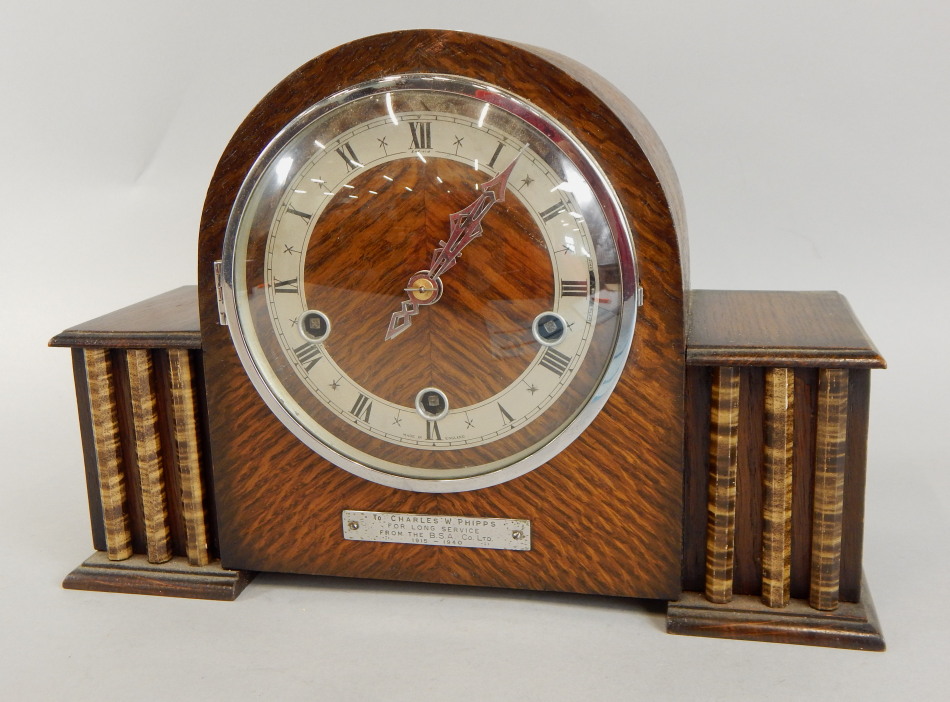 Appraisal: An Art Deco style mantel clock the oak case with