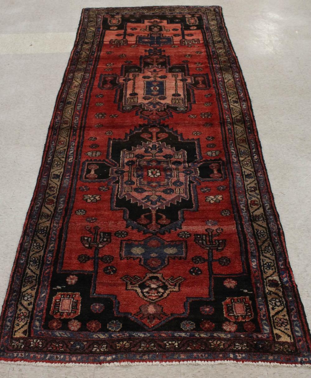 Appraisal: HAND KNOTTED PERSIAN TRIBAL AREA RUG double geometric medallion design