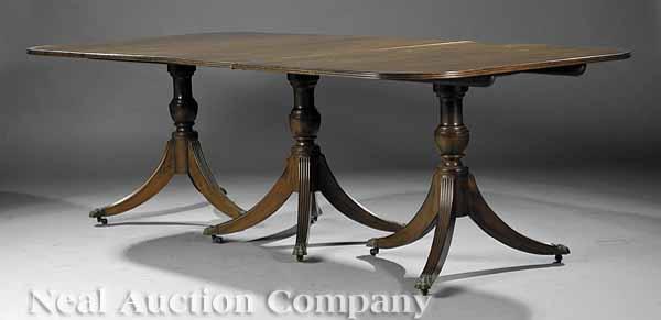 Appraisal: A Georgian-Style Mahogany Three Pedestal Dining Table th c the