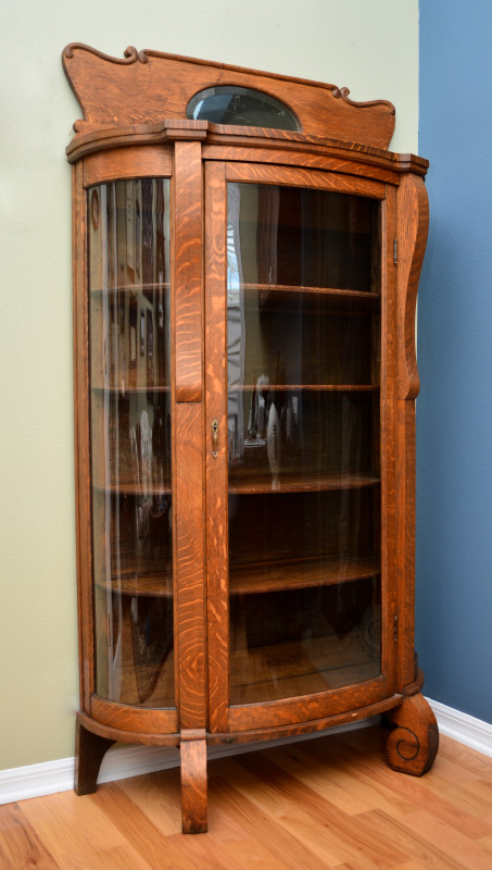 Appraisal: TIGER OAK TRIPLE BOWFRONT CABINET Carved and shaped top backsplash