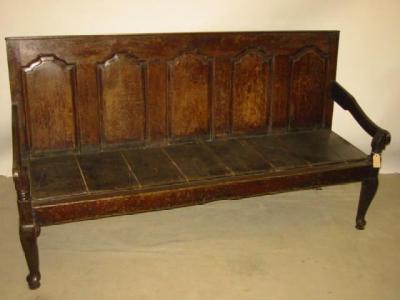 Appraisal: A GEORGE III OAK SETTLE the back with straight top