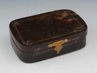 Appraisal: A Tortoise Shell Snuff Box The rectangular box with hinged