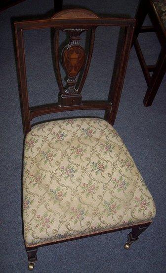 Appraisal: An Edwardian low seat chair with demi-sunburst to the cresting