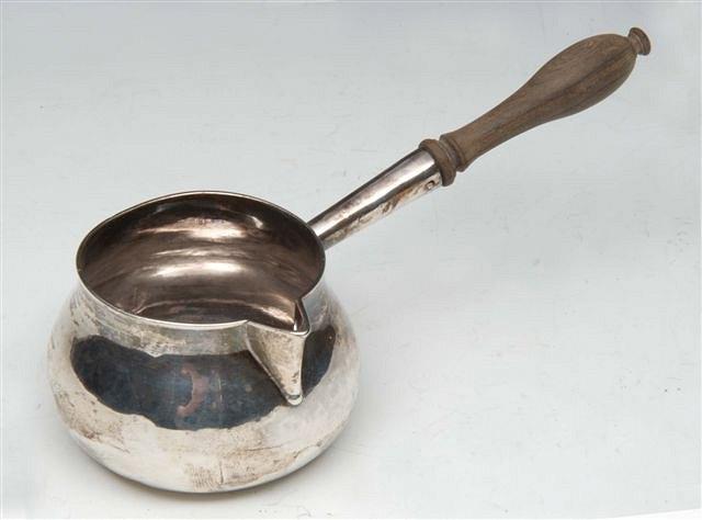 Appraisal: A GEORGE I SILVER BRANDY WARMER with turned wooden handle