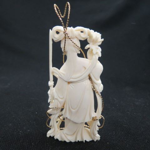 Appraisal: Carved Ivory Pendant of a goddess wrapped in gold-filled wire