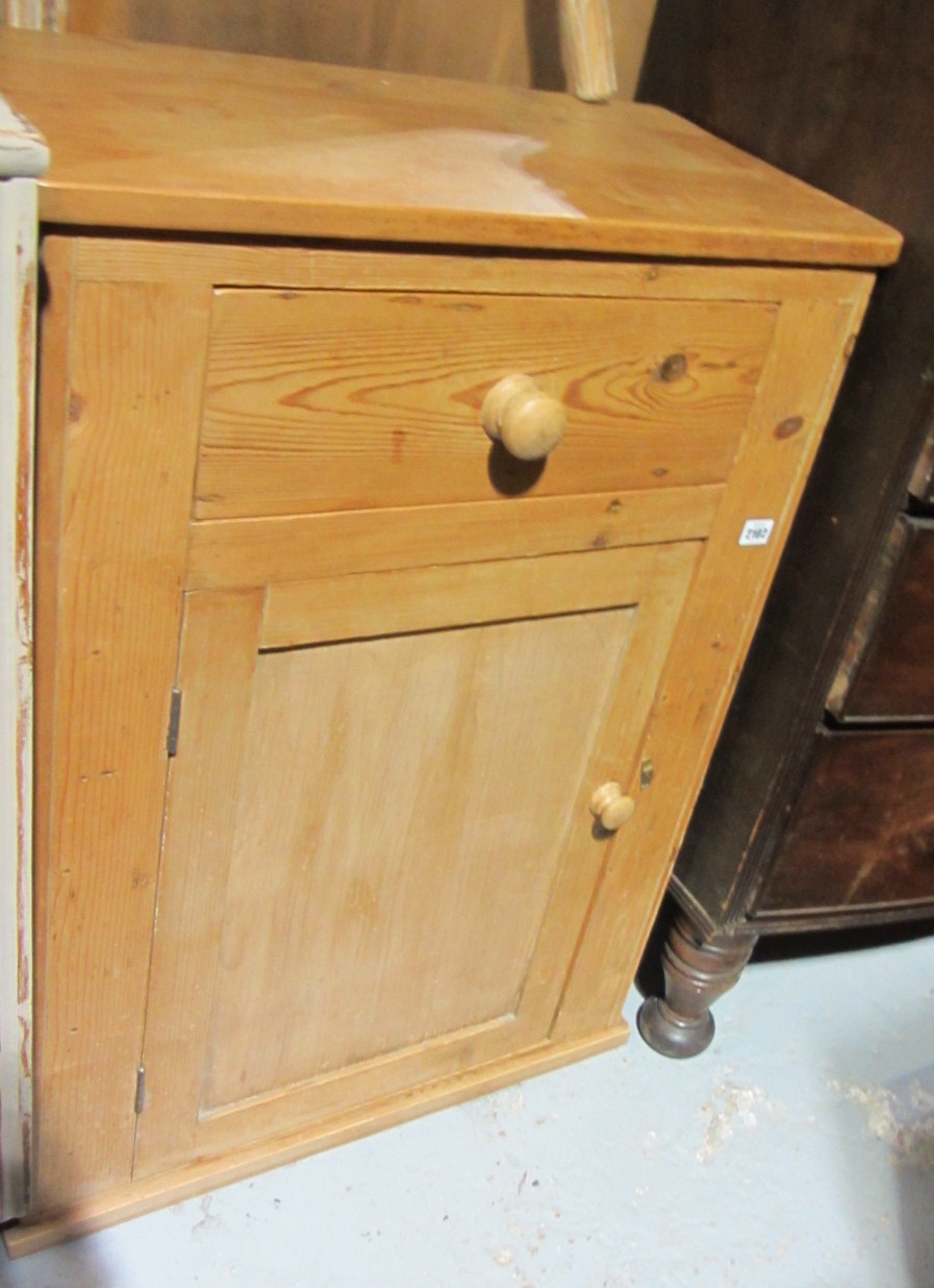 Appraisal: A th century pine wall cupboard with single door and