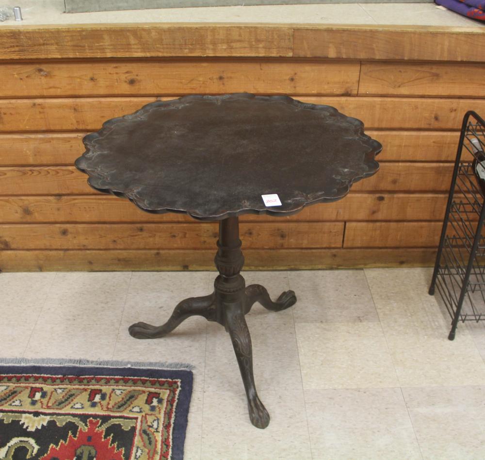 Appraisal: CARVED MAHOGANY TILT-TOP TEA TABLE American th century round top