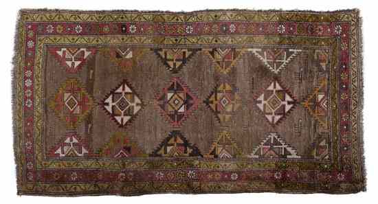 Appraisal: A Northwest Persian Wool Runner decorated with repeating diamond form