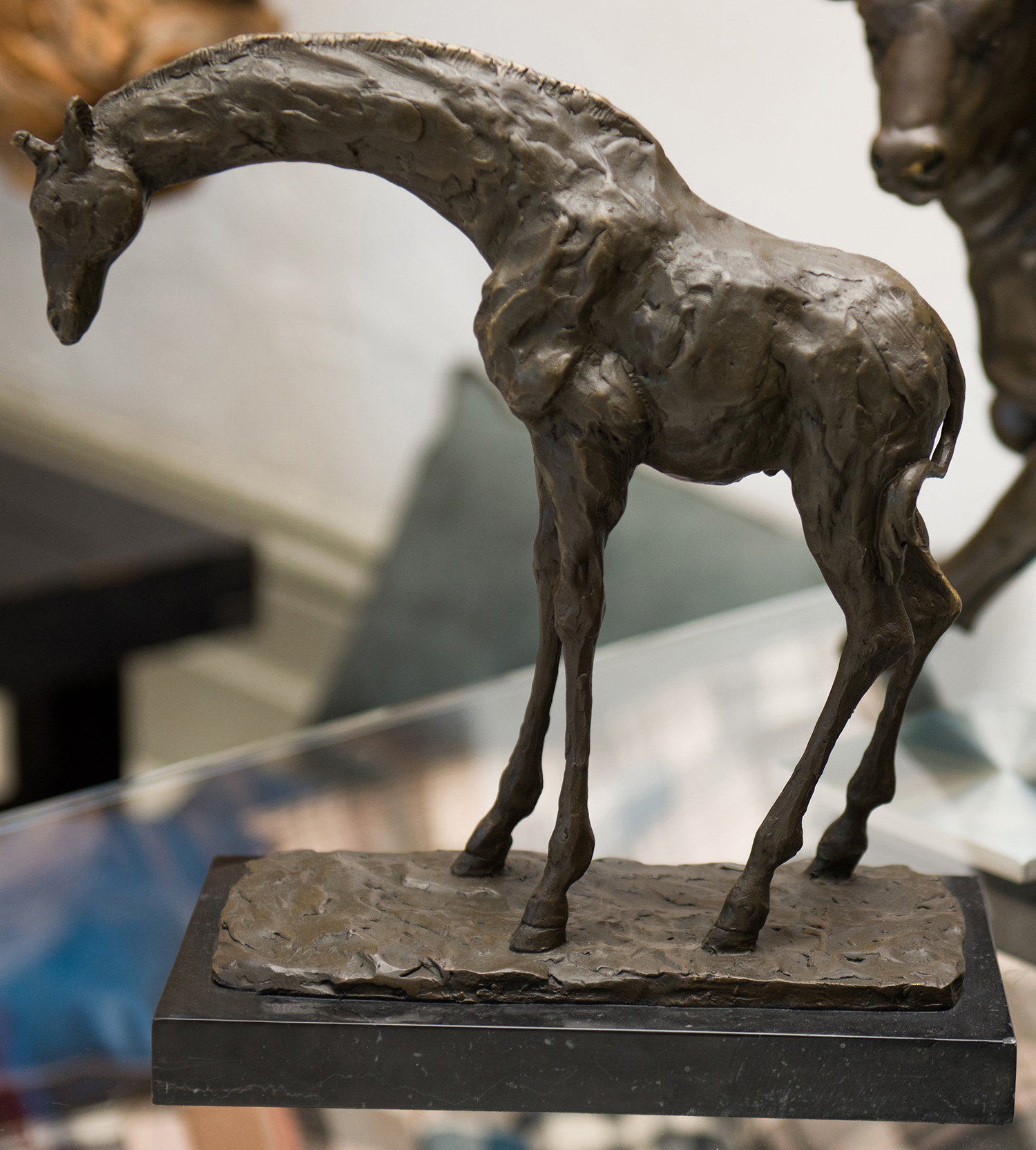 Appraisal: A BRONZE GIRAFFE ON A MARBLE BASE h x w