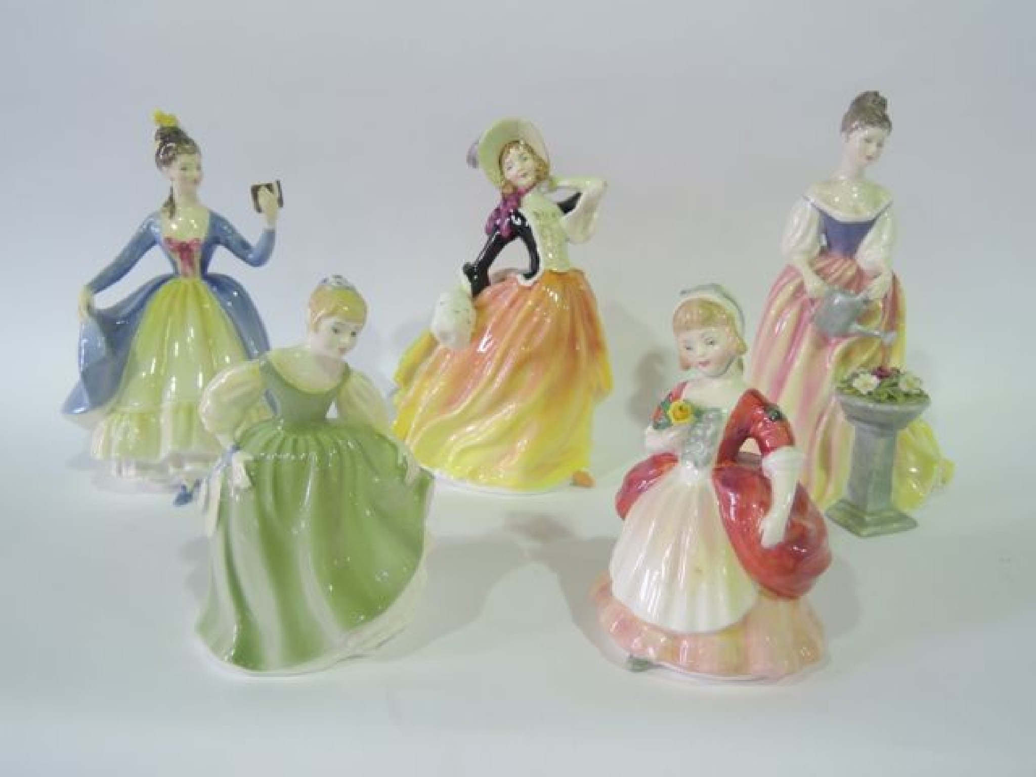 Appraisal: A collection of Royal Doulton figures comprising Autumn Breezes HN