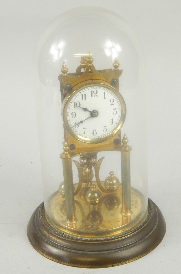 Appraisal: A brass anniversary type clock with enamel dial and glass