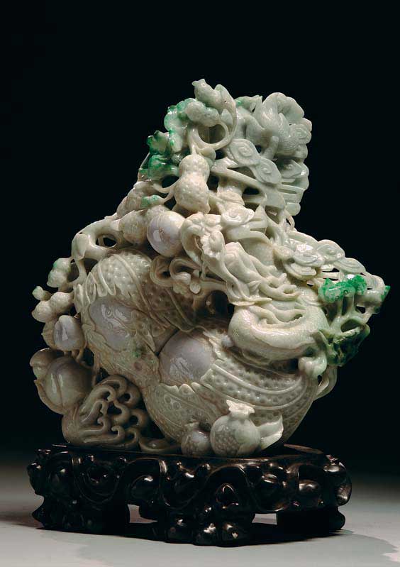 Appraisal: FINE CARVED JADEITE DRAGON FRUIT Finely carved Chinese jadeite dragon