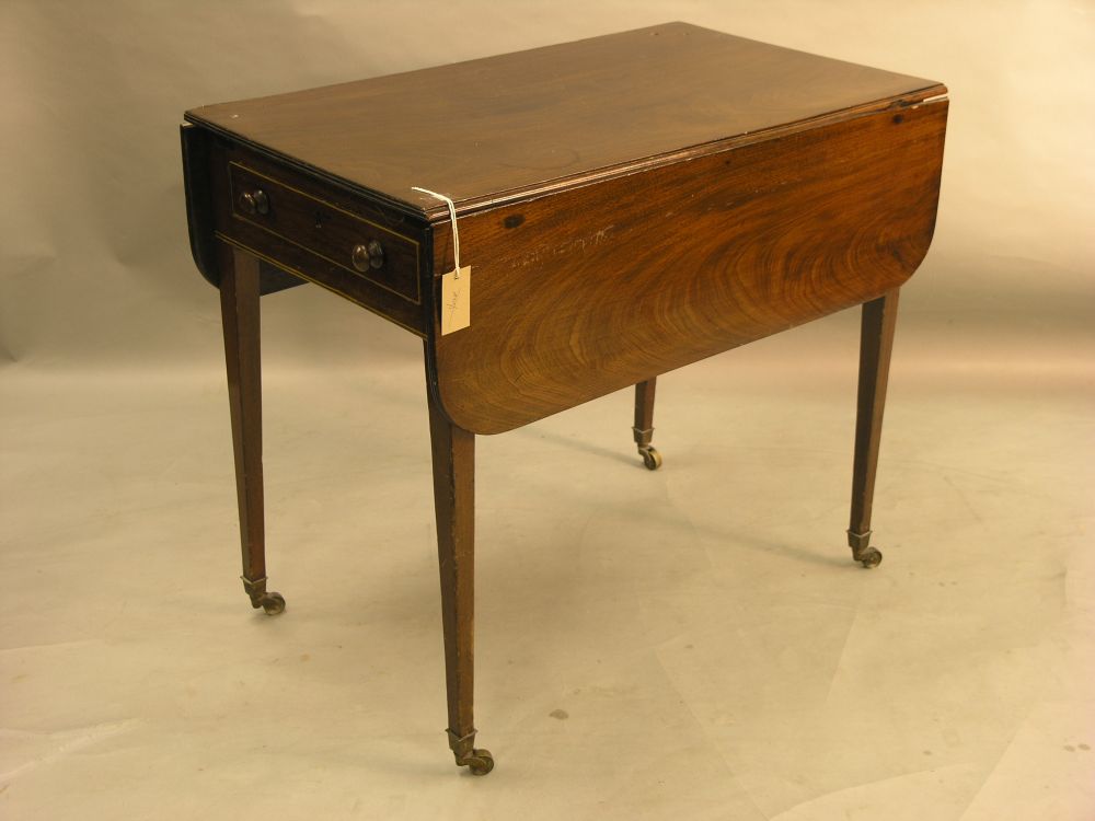 Appraisal: A th century mahogany Pembroke table with single frieze drawer