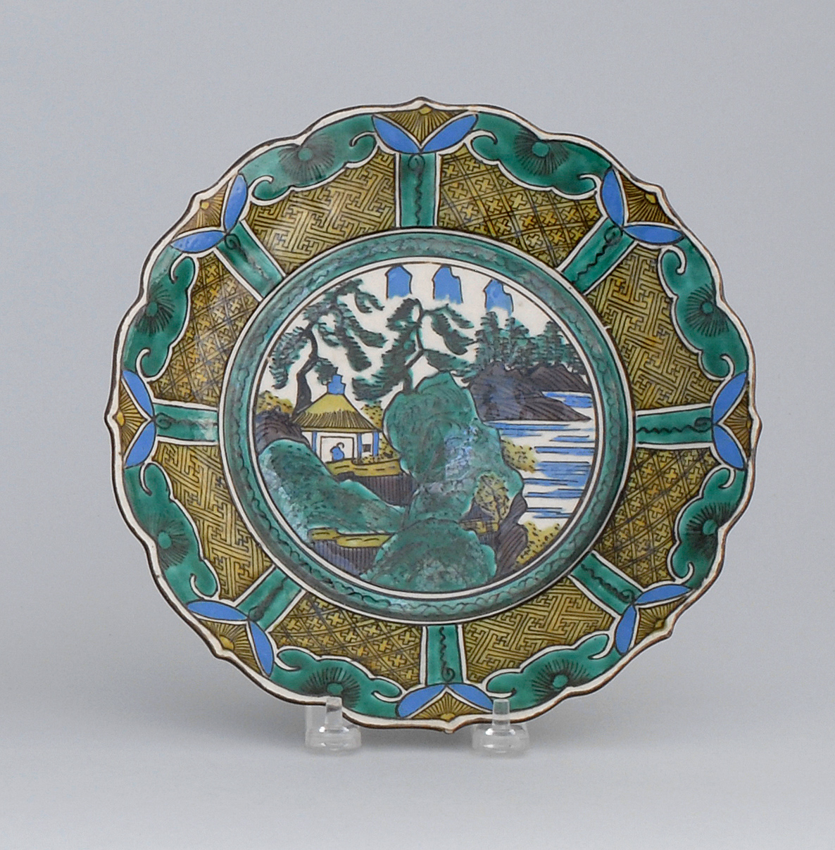 Appraisal: AO KUTANI PLATE In floral form with landscape cartouche Diameter