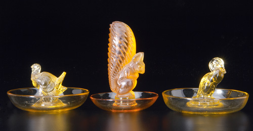 Appraisal: R LALIQUE Three ashtrays Dindon Canard c and Ecureuil c