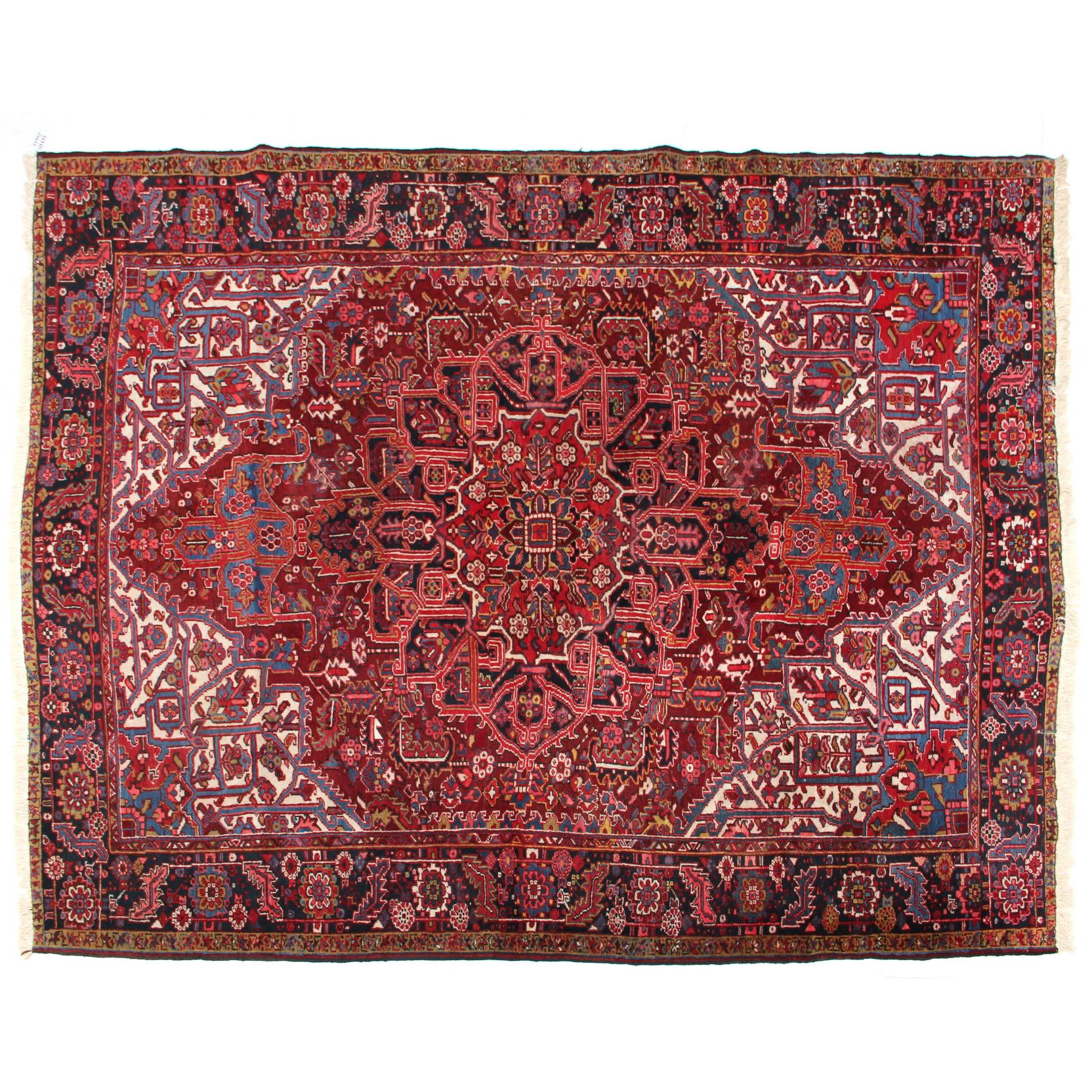 Appraisal: Heriz Carpet circa the dark red field with red medallion