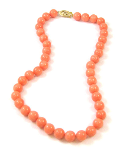 Appraisal: PINK CORAL AND YELLOW GOLD NECKLACE measuring inches in length