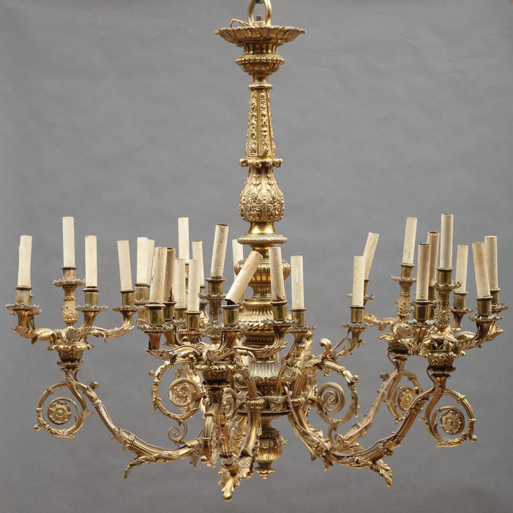 Appraisal: Empire-Style Bronze Thirty-Light Chandelier gadrooned and foliate standard scroll arms