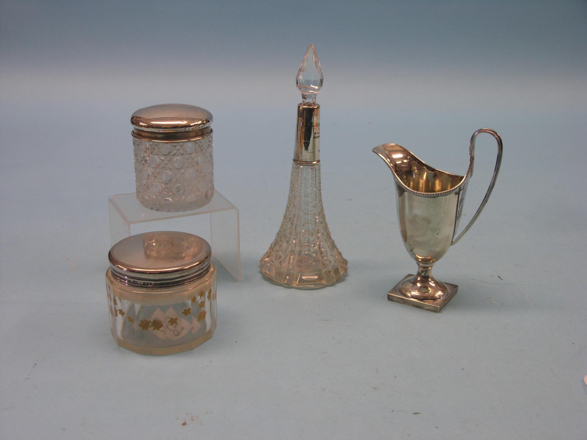 Appraisal: A Jubilee silver helmet-shape cream jug together with two silver-mounted