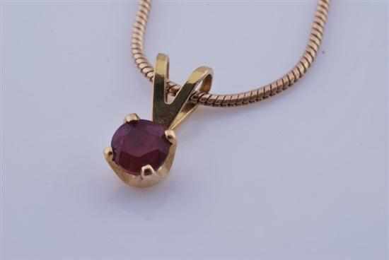 Appraisal: A SMALL RUBY PENDANT WITH CHAIN STAMPED CT GOLD