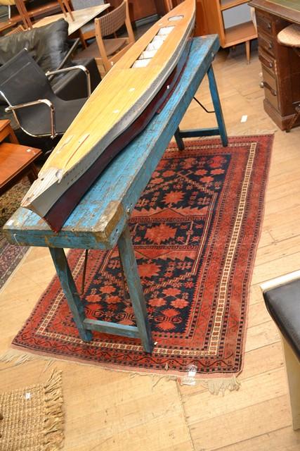 Appraisal: AN AFGHAN RUG IN RED AND BLUE TONES