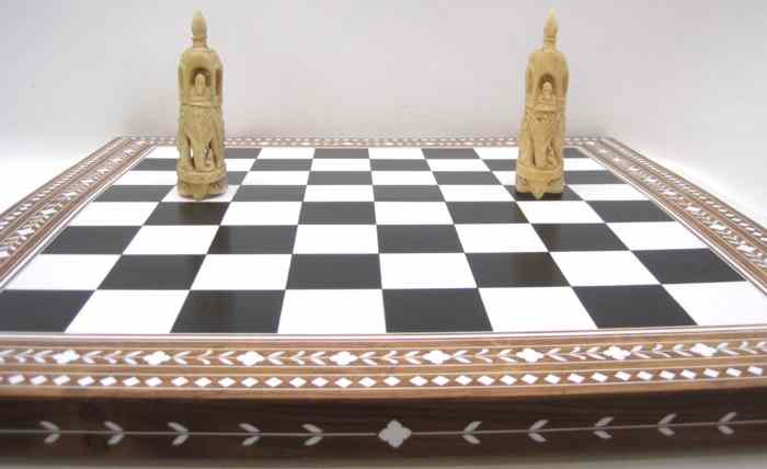 Appraisal: HAND CARVED BONE CHESS SET WITH BOARD in natural white