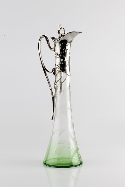 Appraisal: WMF Wurttembergische Metallwarenfabrik Claret jug circa pewter mount with sinuous