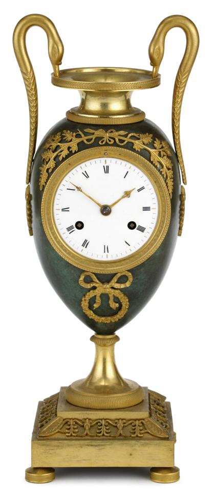 Appraisal: French Empire green patinated and gilt bronze mantel clock early