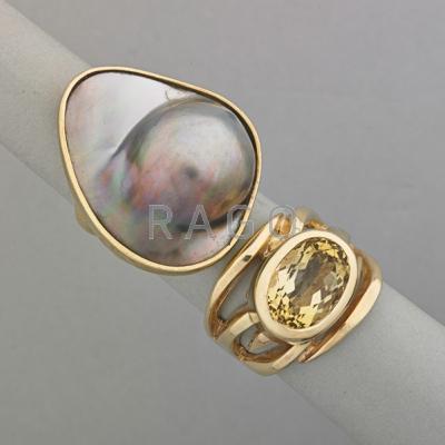 Appraisal: TWO ARTISINAL K YELLOW GOLD RINGS ca Asymmetric black mabe