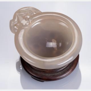 Appraisal: A Chinese Carved Agate Washer on a Carved Hardwood Stand