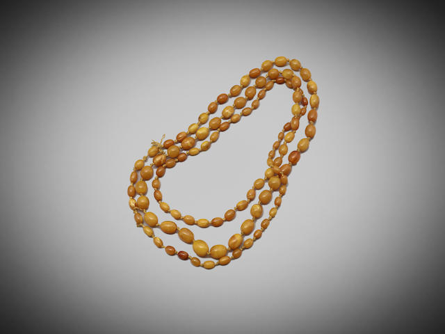 Appraisal: An amber necklace of drilled beads accompanied with a certificate