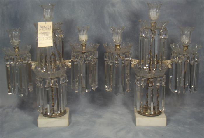 Appraisal: Pair of brass crystal girandoles on white marble bases chips