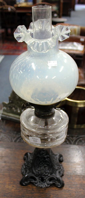 Appraisal: A VICTORIAN CAST IRON YOUNGS SPECIAL OIL LAMP with opaline