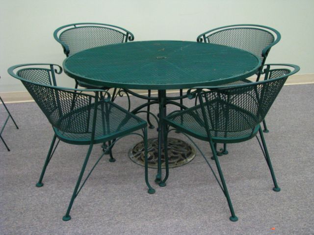 Appraisal: Wrought iron patio table and four chairs green finish inch