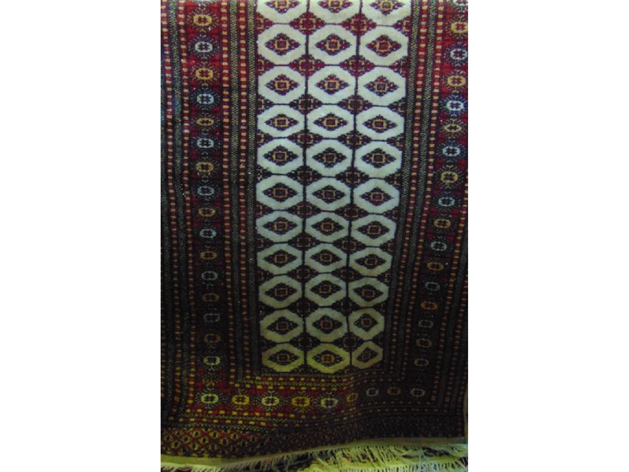 Appraisal: A Persian style wool work runner with multi medallion field