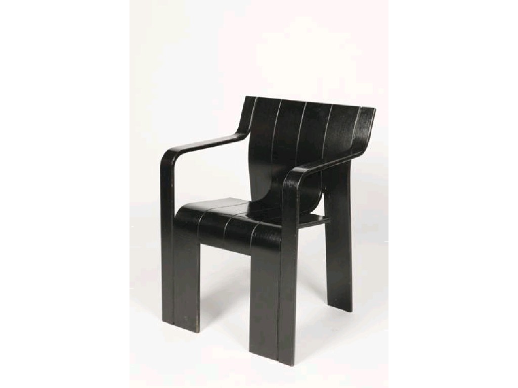 Appraisal: CASTELIJN A DARK STAINED MOULDED PLYWOOD ARMCHAIR of conjoined plank