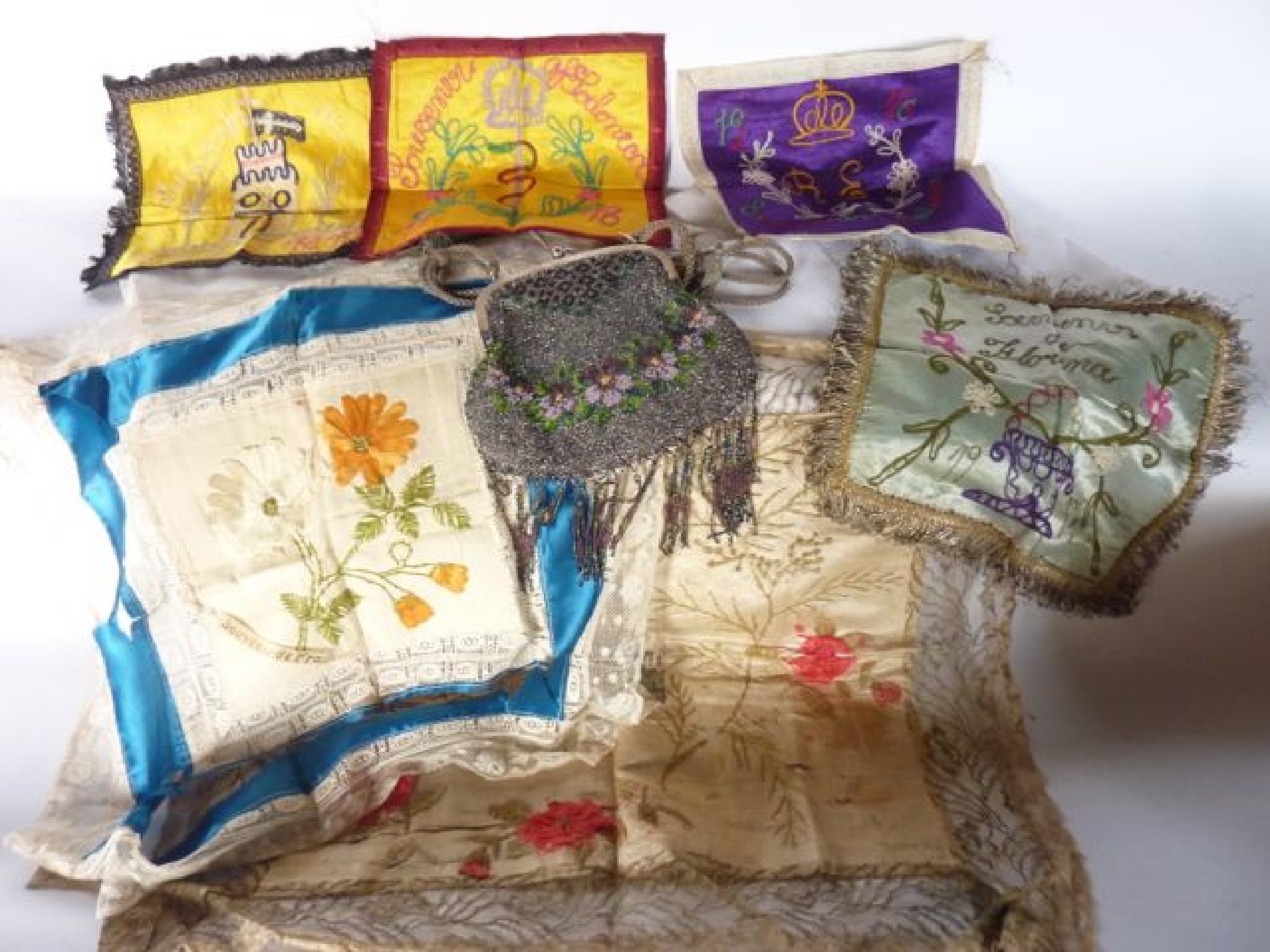 Appraisal: Four brightly coloured silk panels with embroidered detail one on