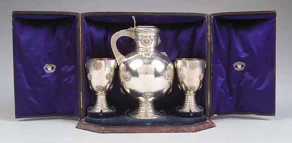 Appraisal: An Impressive Victorian Silverplate Cased Presentation Pitcher and Goblets the