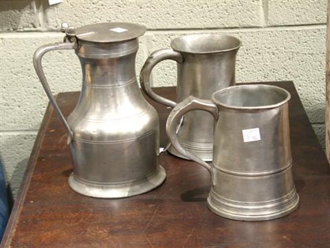 Appraisal: TWO QUART PEWTER MUGS AND A TANKARD The first having