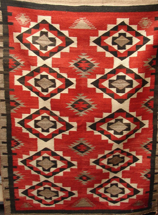 Appraisal: Rug features red brown tan and cream color geometric pattern