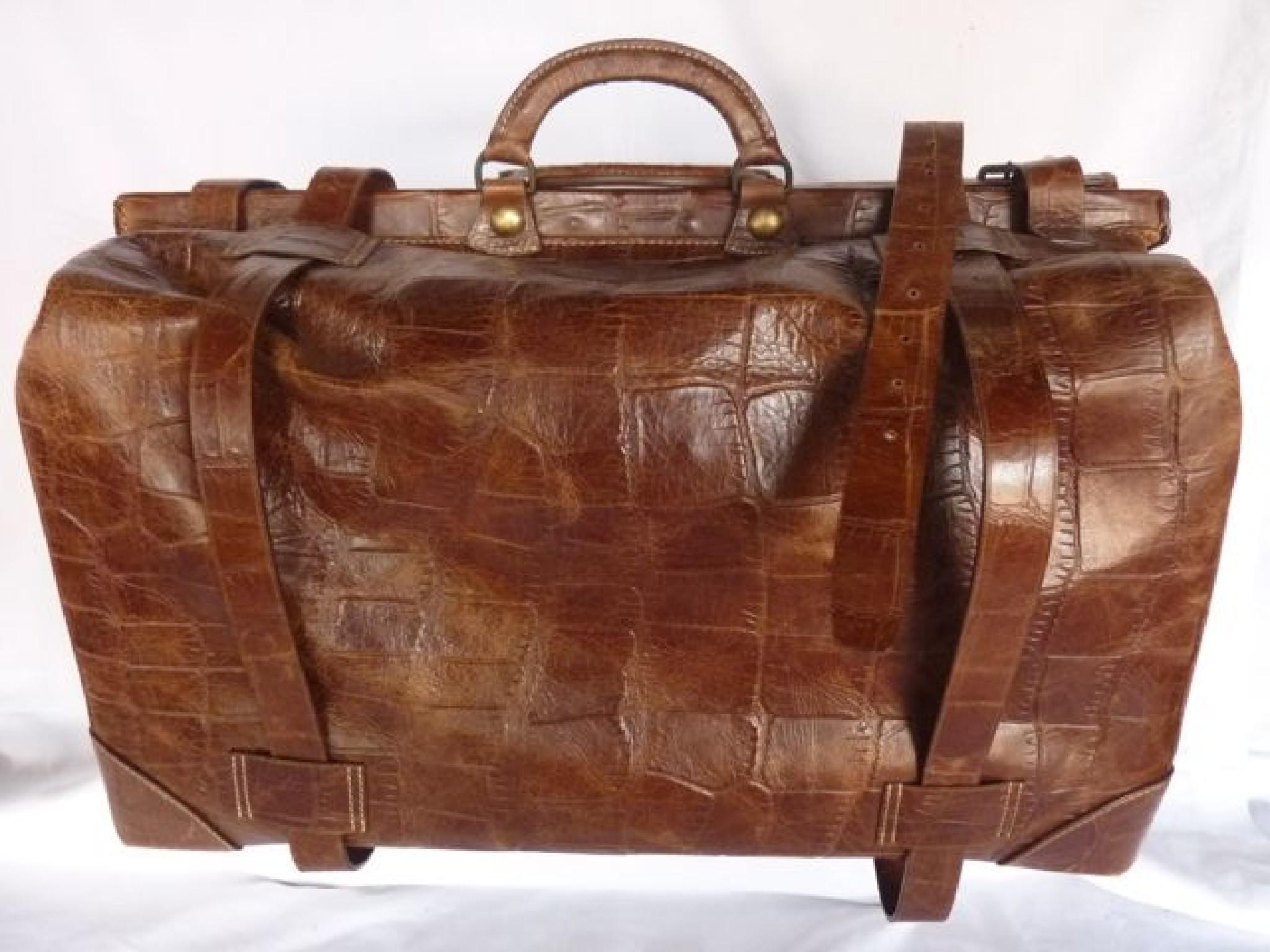 Appraisal: A large vintage style mock alligator skin travelling bag in