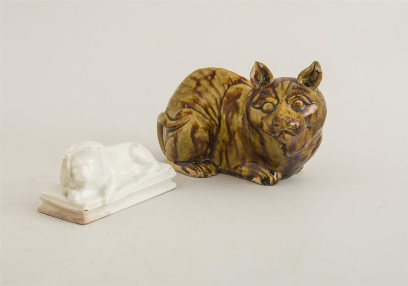 Appraisal: BROWN DRIP-GLAZED POTTERY FIGURE OF A CAT AND AN IVORY-GLAZED