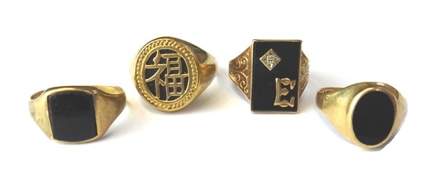 Appraisal: A ct gold rectangular black onyx and diamond set signet