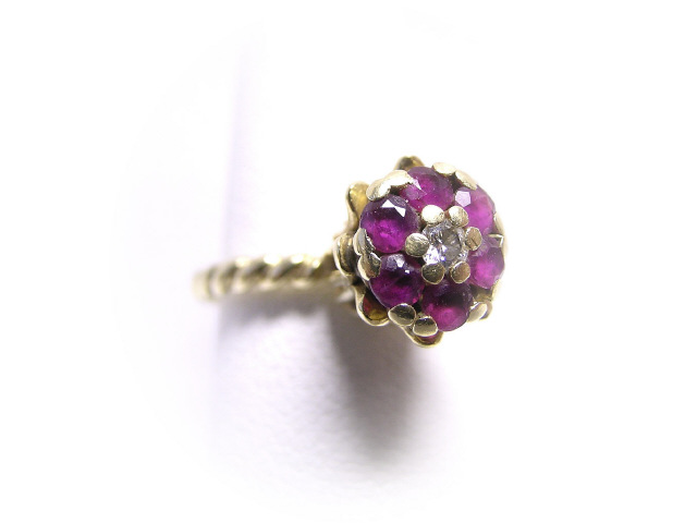 Appraisal: Lady's K yellow gold ruby and diamond dome ring with