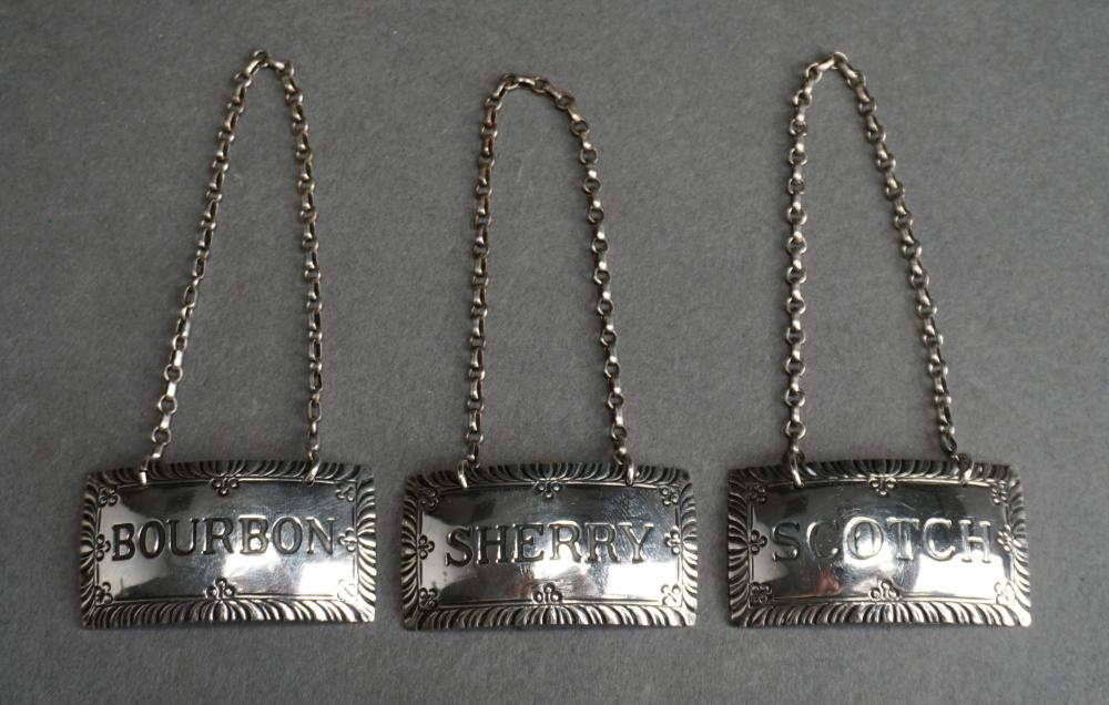 Appraisal: THREE STIEFF WILLIAMSBURG RESTORATION STERLING SILVER BOTTLE TAGS OZTThree Stieff