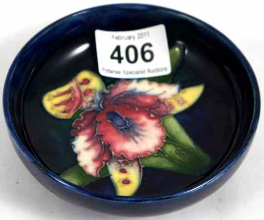 Appraisal: Moorcroft Model of a Footed Bowl decorated with Orchids