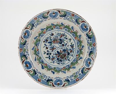 Appraisal: A large Delft dish painted in blue green and red