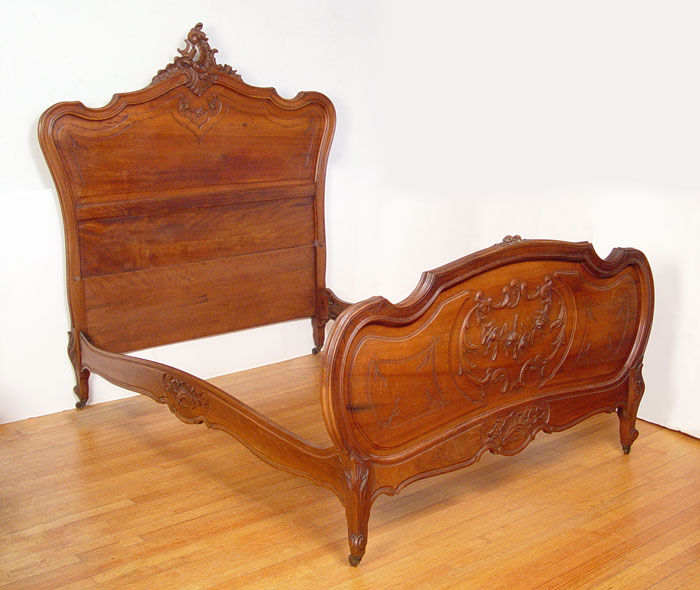 Appraisal: CARVED COUNTRY FRENCH BED Scroll carved crest headboard finely carved