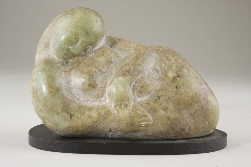 Appraisal: Crete Schuller th c Reclining Nude carved stone female nude