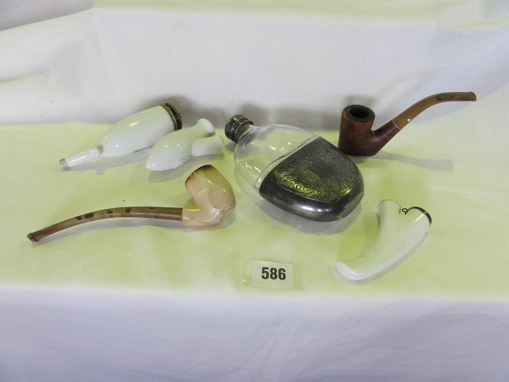 Appraisal: A small collection of pipe bowls and a glass half